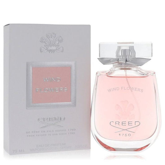 Bottle of Creed Wind Flowers shown next to its packaging