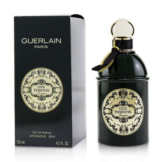 Guerlain Oud Essentiel bottle photographed beside its box