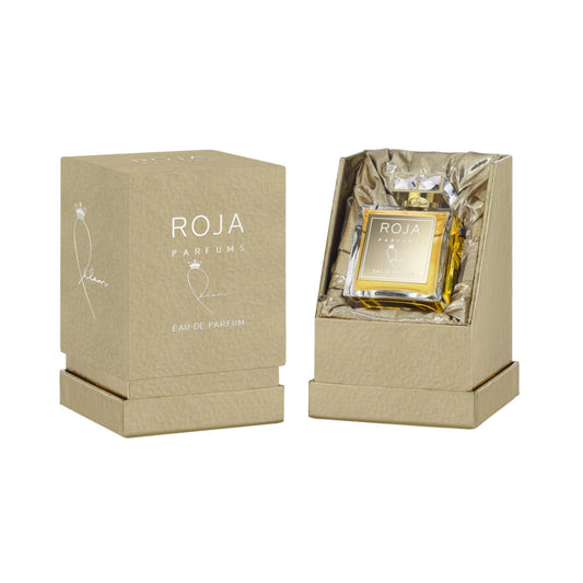 Bottle of Ahlam Roja Dove By Roja shown next to its packaging