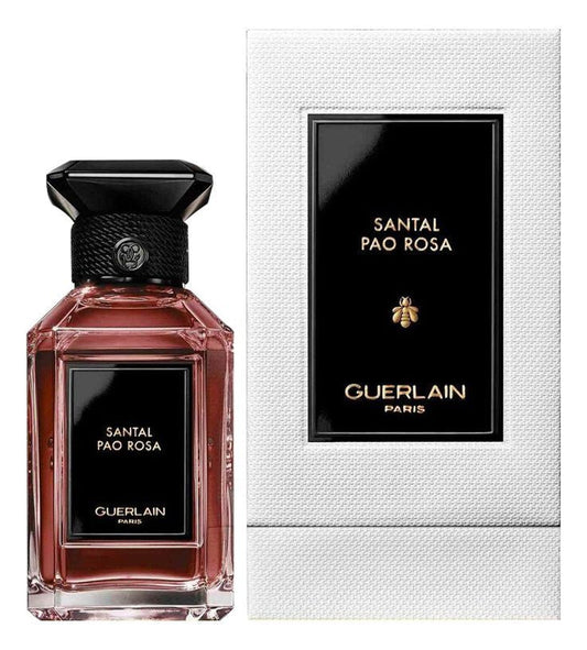 Bottle of Guerlain Santal Pao Rosa shown next to its packaging