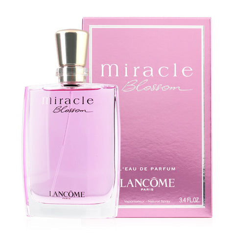 Lancôme Miracle Blossom bottle with box on a plain background