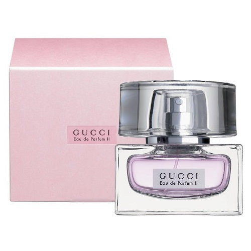 Gucci Eau de Parfum II bottle with box on a plain background