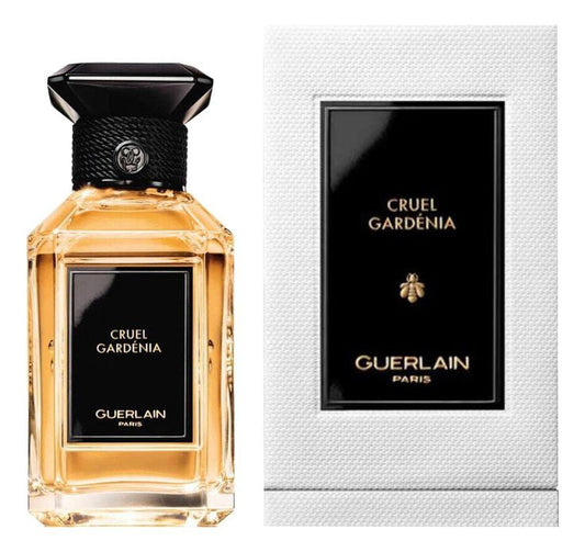 Guerlain Cruel Gardénia bottle with box on a plain background