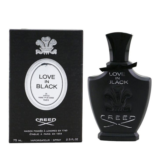 Creed Love In Black bottle with box on a plain background