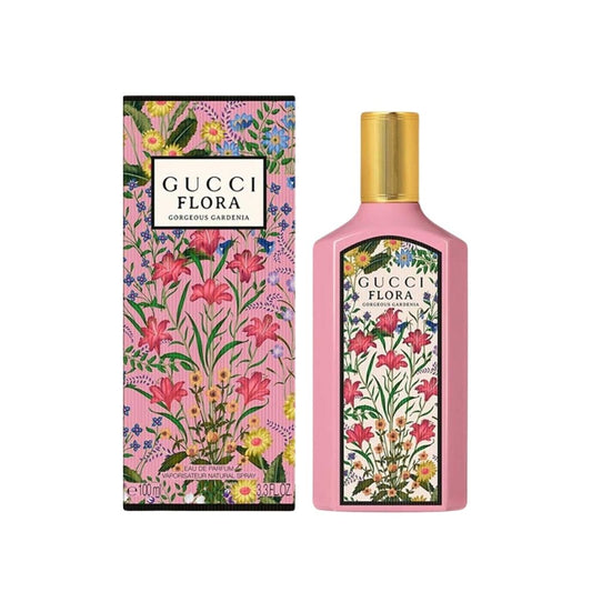 Gucci Flora Gorgeous Gardenia Eau de Parfum bottle with box on a plain background