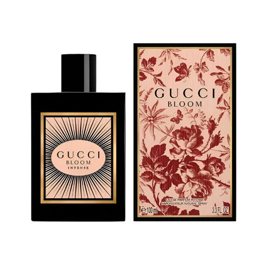 Gucci Bloom Intense bottle with box on a plain background