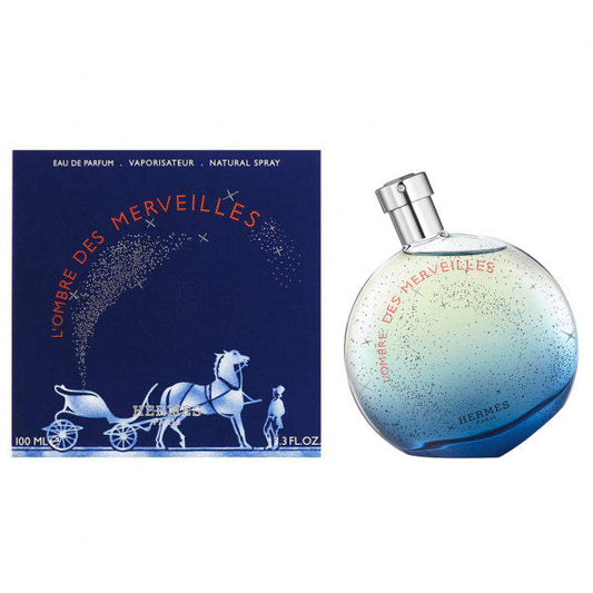 Bottle of Hermès L'Ombre des Merveilles shown next to its packaging