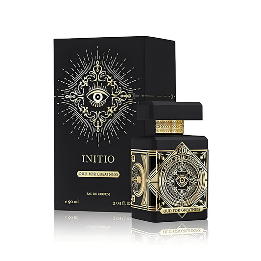 Oud for Greatness Eau de Parfum bottle photographed beside its box